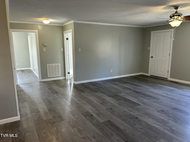 spare room with ornamental molding and dark hardwood / wood-style flooring