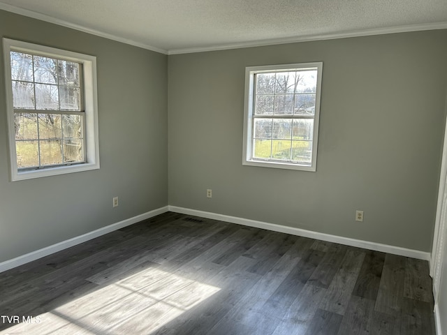 unfurnished room with crown molding, dark hardwood / wood-style floors, and a textured ceiling