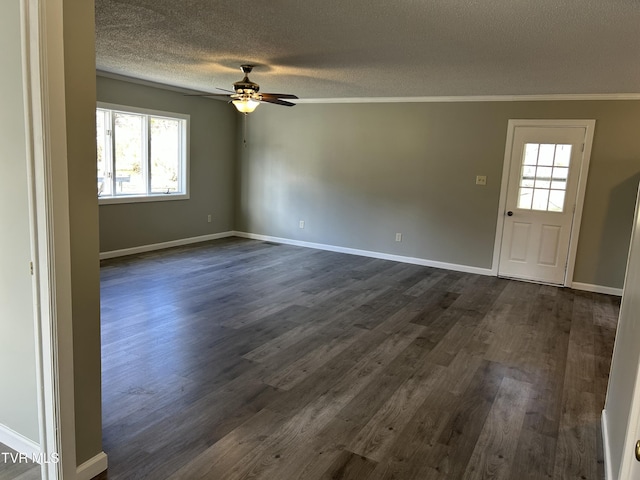 interior space featuring ornamental molding, dark wood-type flooring, ceiling fan, and a textured ceiling