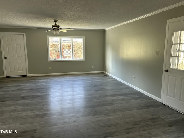 interior space featuring ornamental molding, dark wood-type flooring, ceiling fan, and a textured ceiling