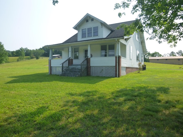 view of front facade with a porch and a front yard