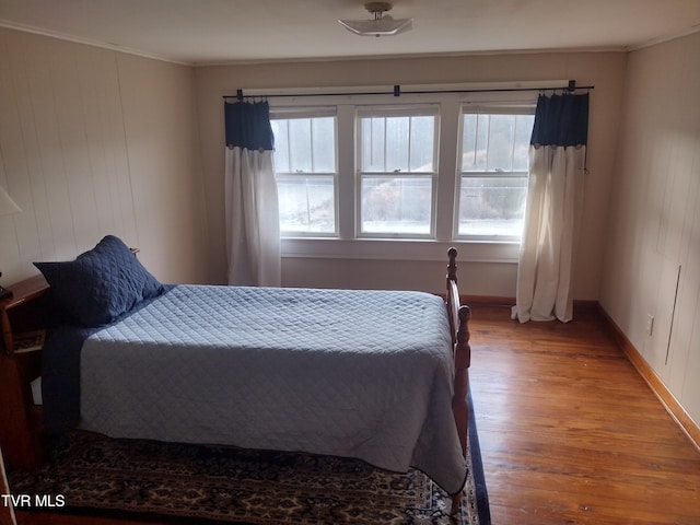 bedroom with wood-type flooring