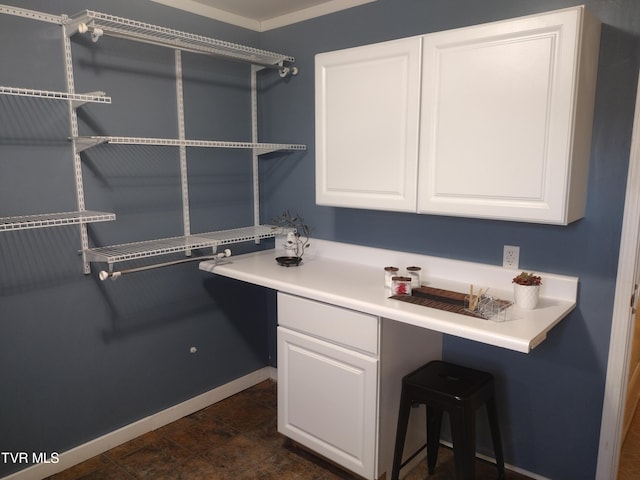 interior space featuring crown molding, tile flooring, and vanity