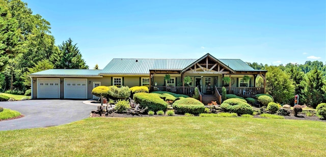 view of front facade with a front yard and a garage