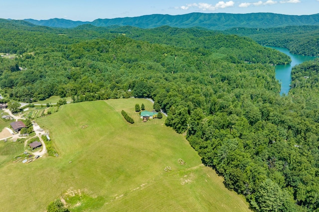 aerial view featuring a water and mountain view