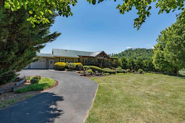 view of front of property with a front lawn and a garage