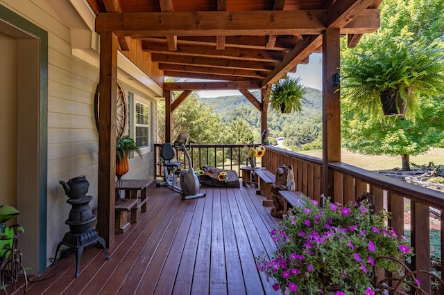 wooden deck with a mountain view