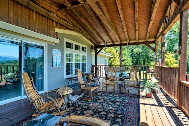 wooden terrace with a mountain view