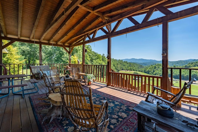 wooden terrace featuring a mountain view