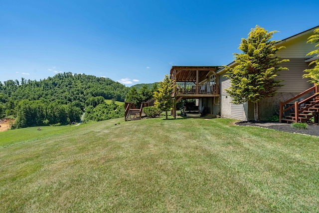 view of yard featuring a wooden deck