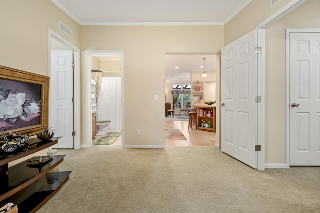 interior space featuring light carpet and crown molding