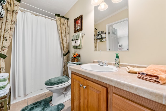 bathroom with tile floors, toilet, and vanity