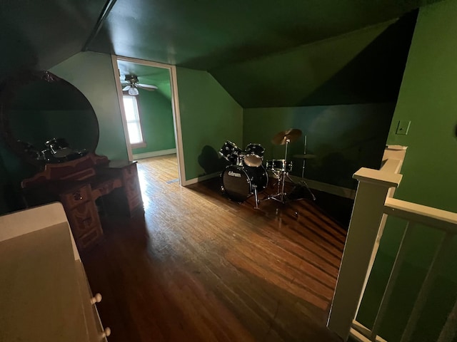 bedroom with vaulted ceiling and wood-type flooring