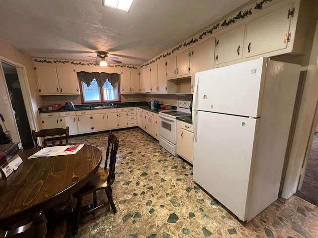 kitchen featuring a textured ceiling, ceiling fan, white appliances, sink, and light tile flooring