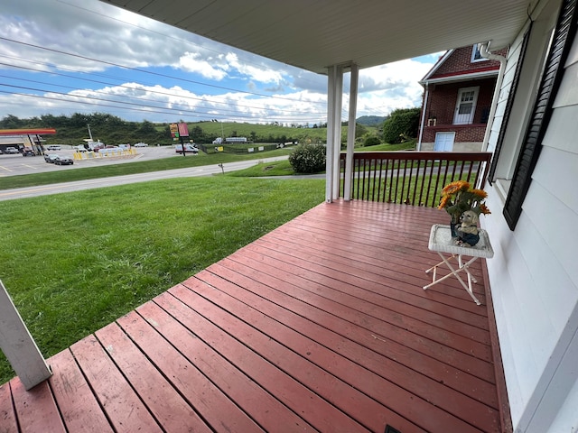 wooden deck with a yard