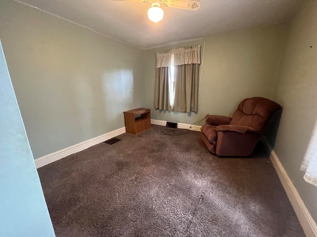 unfurnished room featuring ceiling fan and carpet flooring