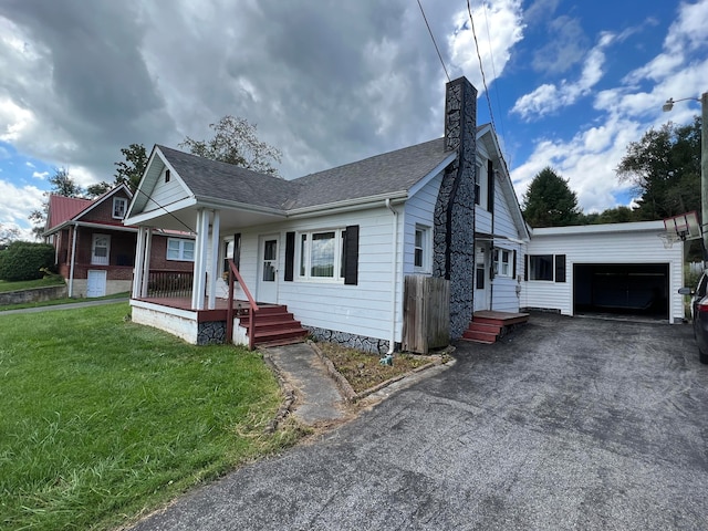 bungalow with a front lawn and a garage