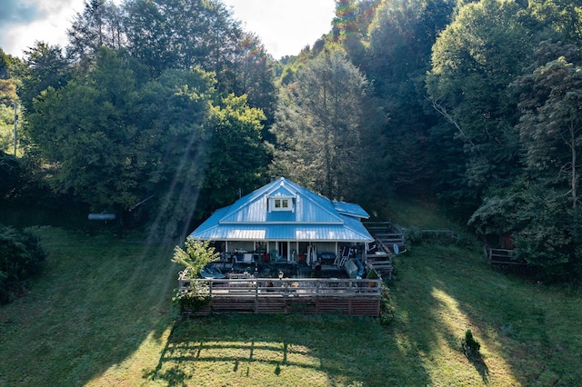 rear view of house with a lawn