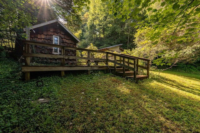 view of yard with a wooden deck