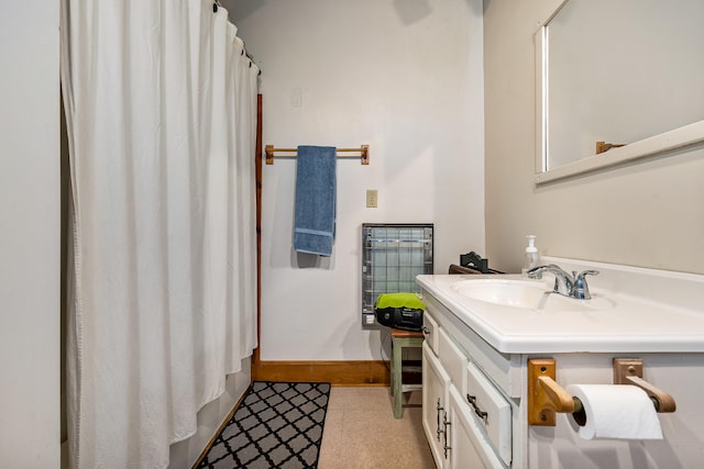 bathroom featuring oversized vanity and tile floors