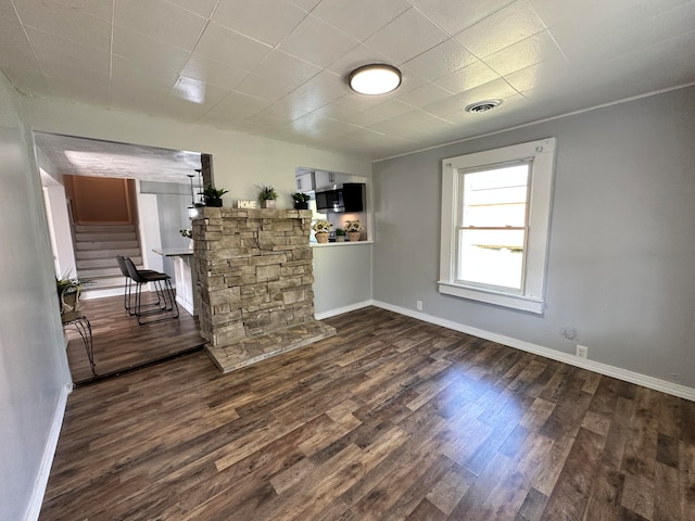 spare room featuring dark hardwood / wood-style flooring