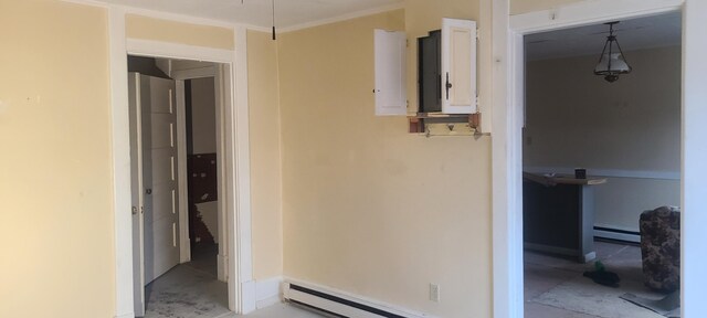 corridor featuring a baseboard radiator and ornamental molding