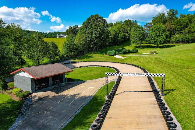 view of property's community with a yard