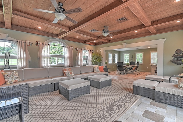 tiled living room featuring beam ceiling, ceiling fan, and wooden ceiling