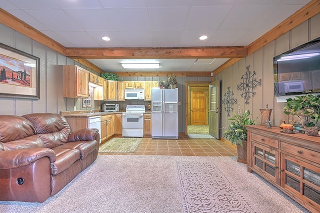 living room with light tile flooring and beamed ceiling