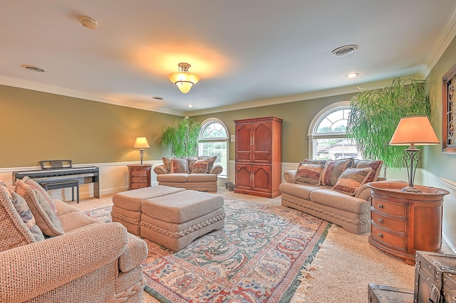 living room with ornamental molding and light carpet