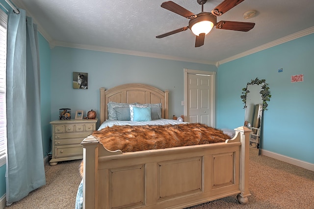 carpeted bedroom featuring crown molding, a closet, a textured ceiling, and ceiling fan