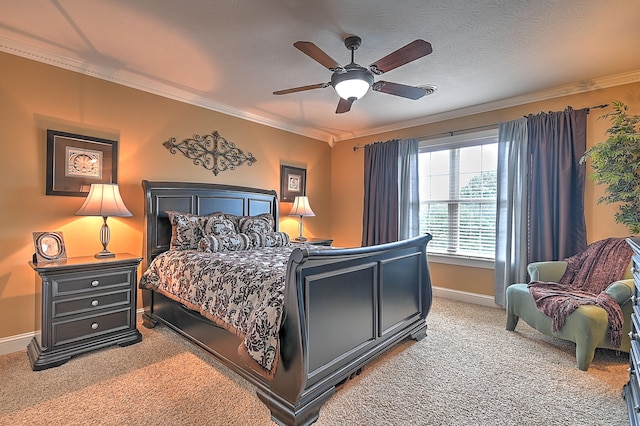 bedroom featuring ceiling fan, ornamental molding, and carpet floors