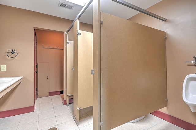 bathroom featuring tile floors