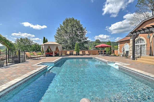 view of swimming pool featuring a patio