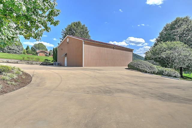 view of side of home featuring a garage