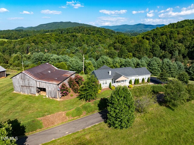 birds eye view of property with a mountain view