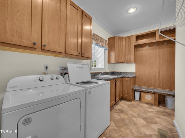 laundry area with cabinets, crown molding, washer and clothes dryer, and sink