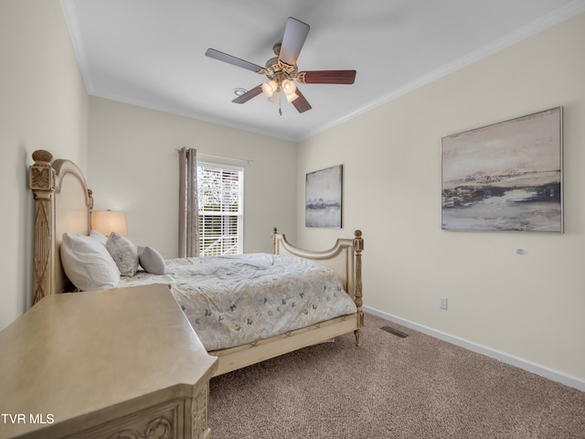 bedroom featuring ornamental molding, ceiling fan, and carpet floors