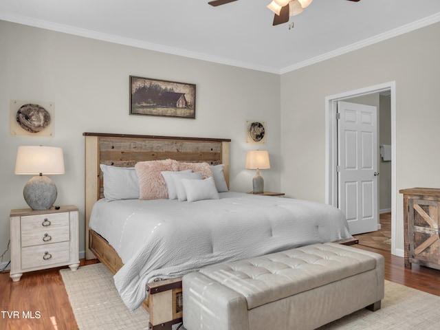 bedroom with ceiling fan, light hardwood / wood-style floors, and crown molding