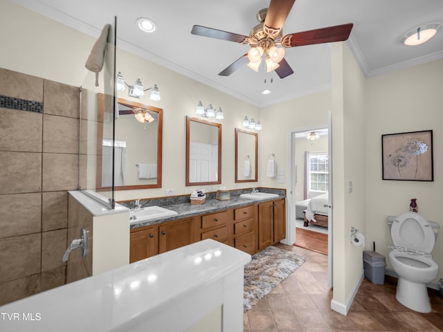 bathroom with crown molding, tile patterned floors, toilet, ceiling fan, and vanity