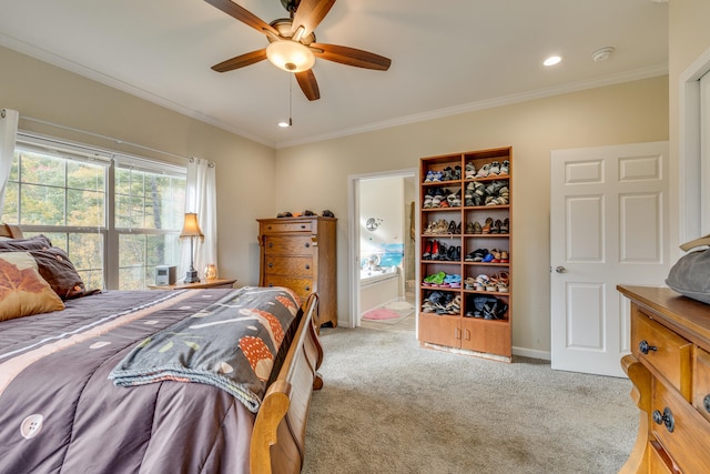 bedroom featuring light carpet, ornamental molding, and ceiling fan