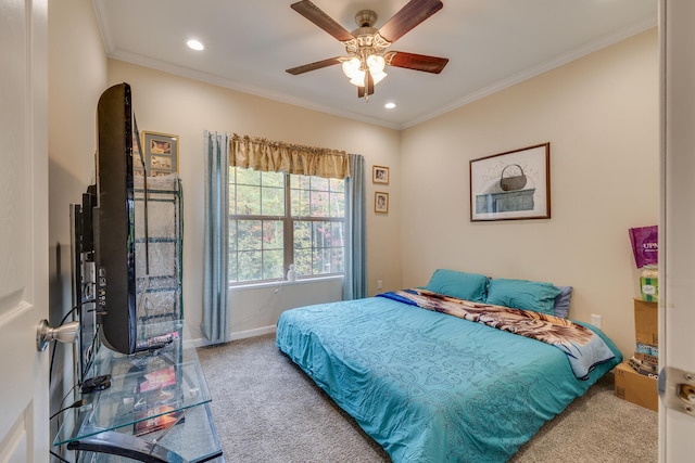 bedroom with crown molding, light colored carpet, and ceiling fan