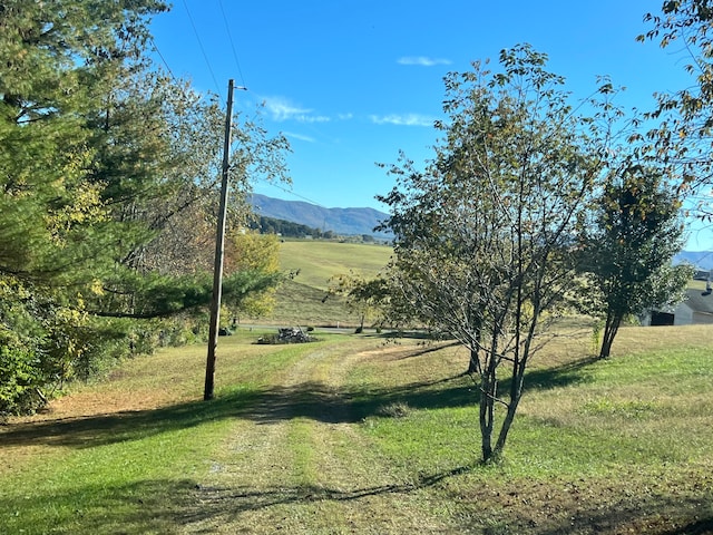 property view of mountains featuring a rural view