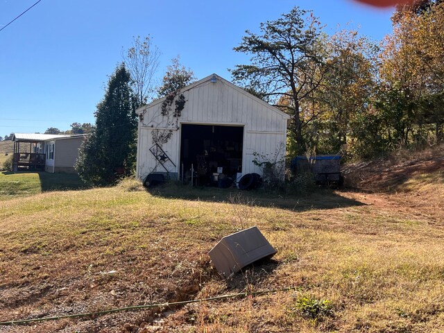 view of outdoor structure featuring a lawn