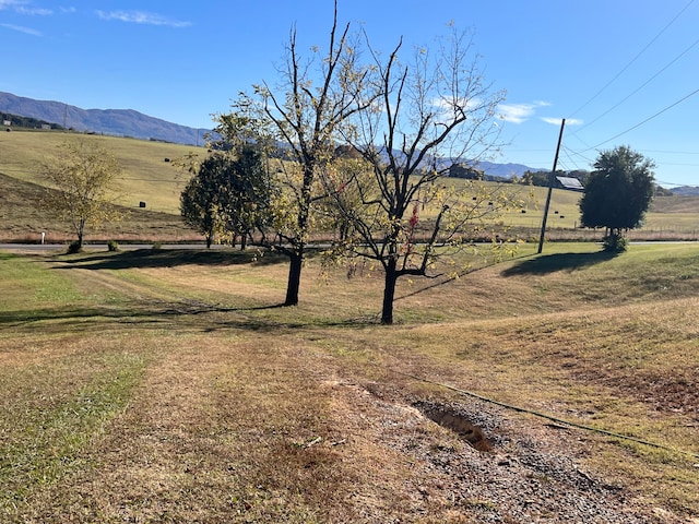 view of mountain feature with a rural view