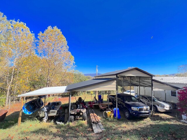 view of parking / parking lot featuring a carport