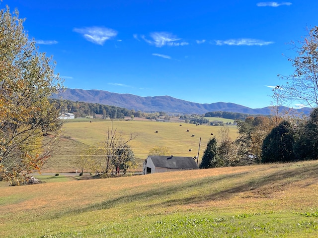 mountain view featuring a rural view