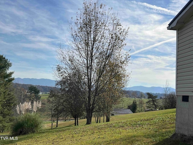 mountain view featuring a rural view