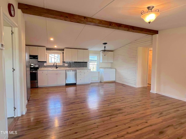 kitchen featuring pendant lighting, plenty of natural light, white cabinetry, and appliances with stainless steel finishes