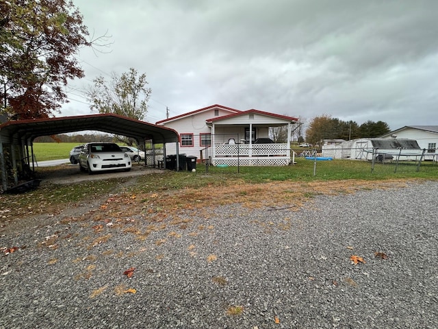 view of front of house with a carport and covered porch